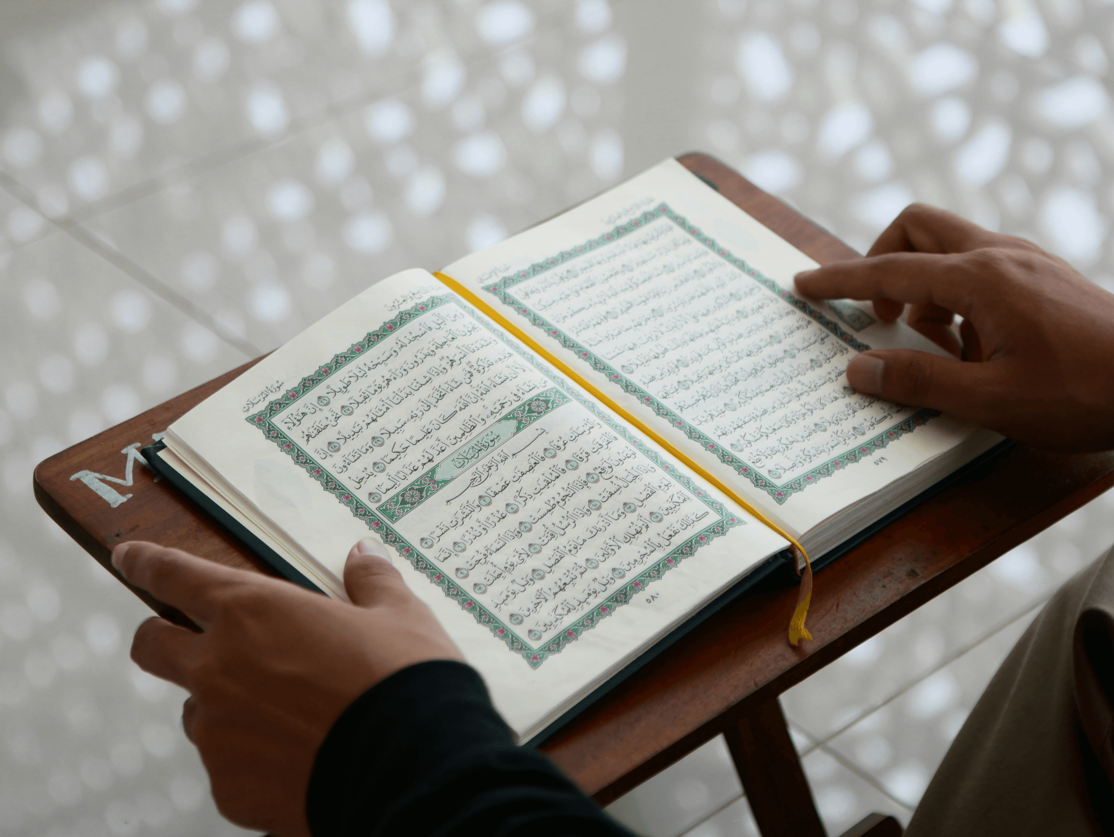 Student reading the Holy Quran